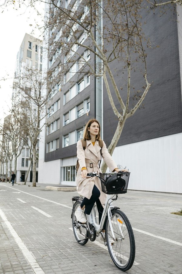 What are the steps to set up a UK-based electric bike sharing service and adhere to transportation laws?